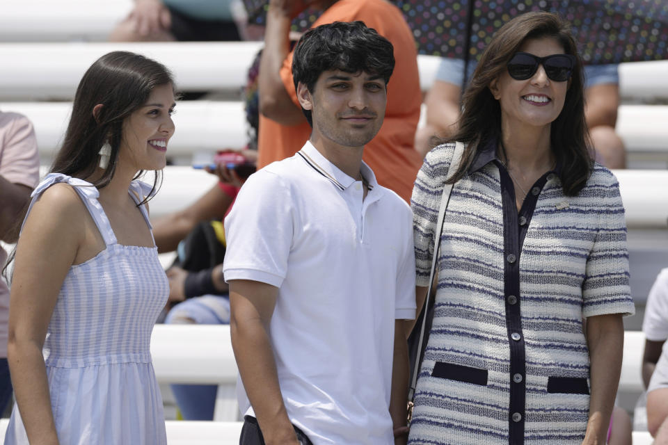 Republican presidential candidate Nikki Haley, right, stands with her children as they arrive at a deployment ceremony for her husband's South Carolina National Guard unit on Saturday, June 17, 2023, in Charleston, S.C. Maj. Michael Haley's yearlong deployment to Africa will encompass much of the campaign of his wife, former Gov. Nikki Haley, for the 2024 GOP presidential nomination. (AP Photo/Meg Kinnard)