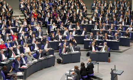 Delegates vote during the first plenary session at the German lower house of Parliament, Bundestag, after a general election in Berlin, Germany, October 24, 2017. REUTERS/Fabrizio Bensch