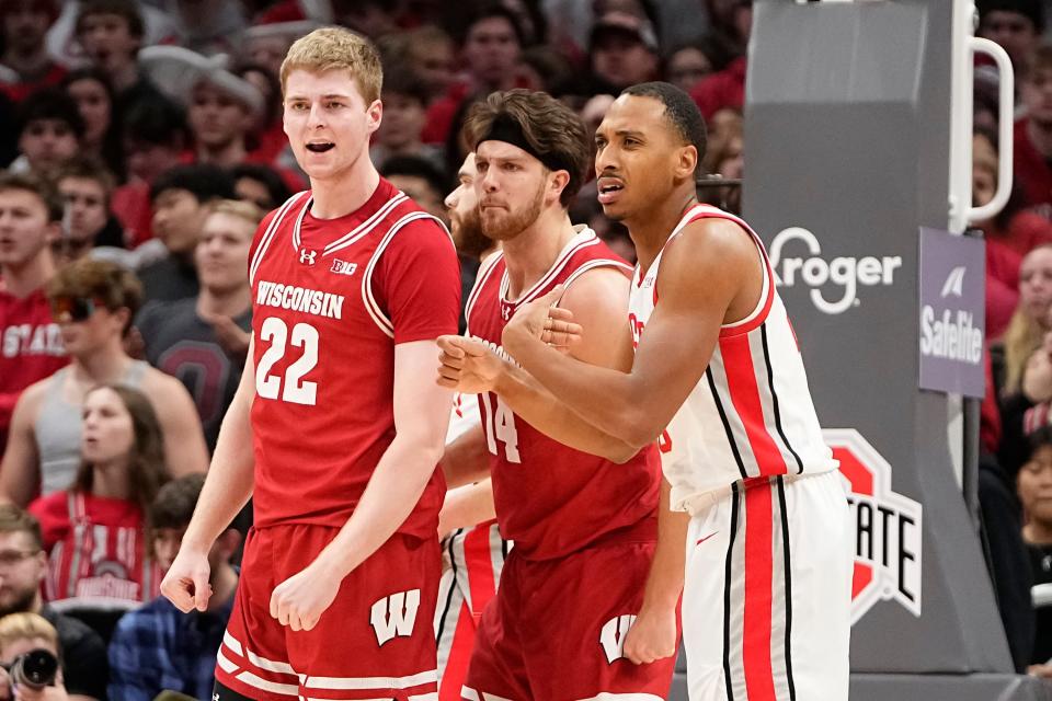 Jan 10, 2024; Columbus, Ohio, USA; Wisconsin Badgers forward Steven Crowl (22) celebrates a shot with forward Carter Gilmore (14) in front of Ohio State Buckeyes forward Zed Key (23) during the second half of the NCAA men’s basketball game at Value City Arena. Ohio State lost 71-60.