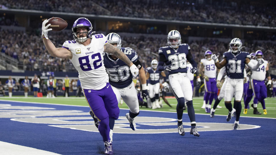 Minnesota Vikings tight end Kyle Rudolph (82) catches a first-quarter touchdown past next to Dallas Cowboys outside linebacker Sean Lee (50) during an NFL football game Sunday, Nov. 10, 2019, in Arlington, Texas. (Jerry Holt/Star Tribune via AP)