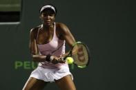 Mar 27, 2017; Miami, FL, USA; Venus Williams of the United States hits a backhand against Svetlana Kuznetsova of Russia (not pictured) on day seven of the 2017 Miami Open at Crandon Park Tennis Center. Williams won 6-3, 7-6(4). Mandatory Credit: Geoff Burke-USA TODAY Sports