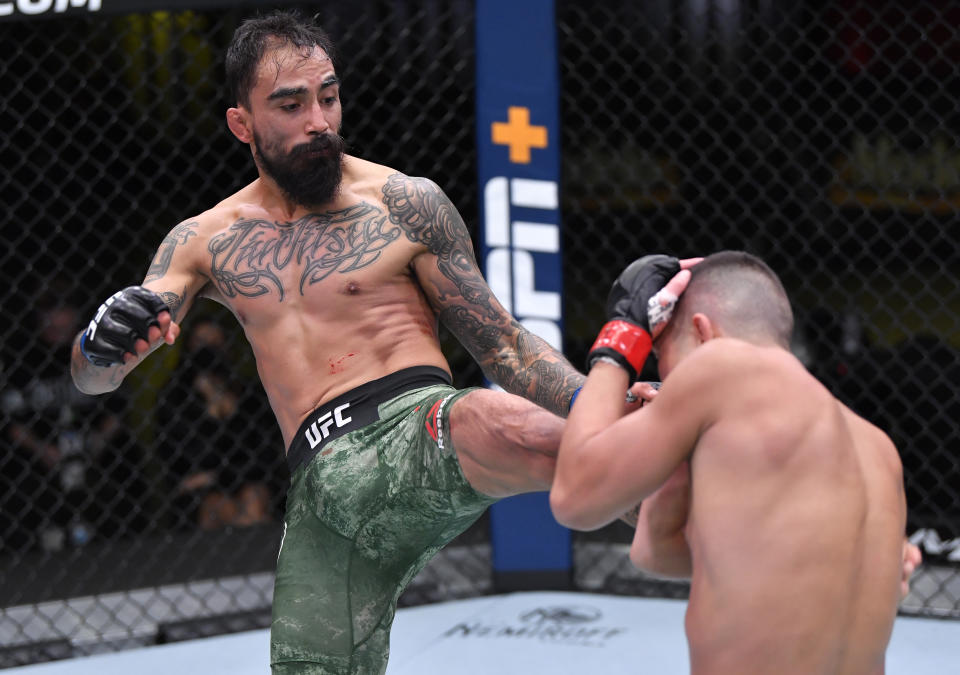 LAS VEGAS, NEVADA – DECEMBER 05: (L-R) Jose Quinonez of Mexico kicks Louis Smolka in a bantamweight bout during the UFC Fight Night event at UFC APEX on December 05, 2020 in Las Vegas, Nevada. (Photo by Chris Unger/Zuffa LLC)