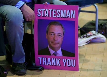 A supporter holds a poster of Nigel Farage, the outgoing leader of the United Kingdom Independence Party (UKIP), at the party's annual conference in Bournemouth, Britain, September 16, 2016. REUTERS/Toby Melville