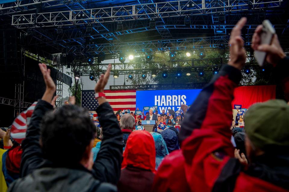 People clap for Minnesota Gov. and Democratic vice presidential candidate Tim Walz during his speech at Salvage Station, September 17, 2024, in Asheville, North Carolina.