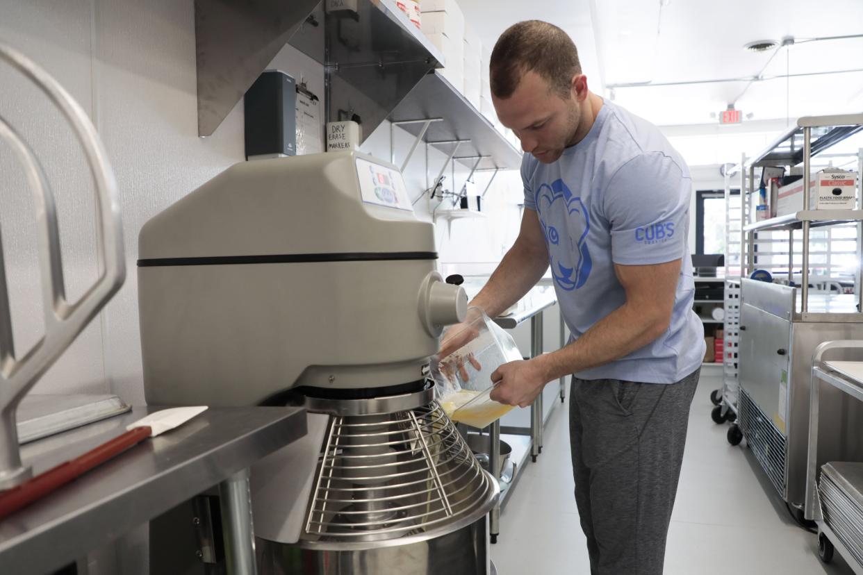 Owner Brad Kaplan pours melted butter into a mixer as he makes vanilla frosting at Lion Cub's Cookies, 1261 Grandview Ave., on Tuesday, June 22, 2021 in Grandview Heights, Ohio. During the COVID-19 pandemic, the bakery started a thriving cookie delivery business and will open its first physical store and bakery this Friday.
