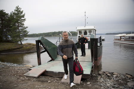 NATO Secretary-General Jens Stoltenberg leaves the Labour Youth Organisation (AUF) summer camp after staying the night on the island in Utoya, August 7, 2015. REUTERS/Toratein Boe/NTB Scanpix