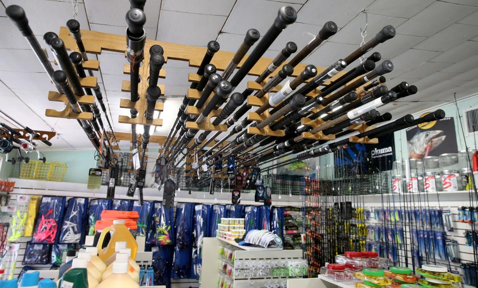 Fishing rods hang from the ceiling of Gabriel Tackle Co. on Mantoloking Road in Brick Monday, June 13, 2022.  The five-year-old bait and tackle shop also has a location in Lavallette. 