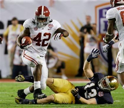 Alabama's Eddie Lacy ran through and over the Notre Dame defense. (AP)