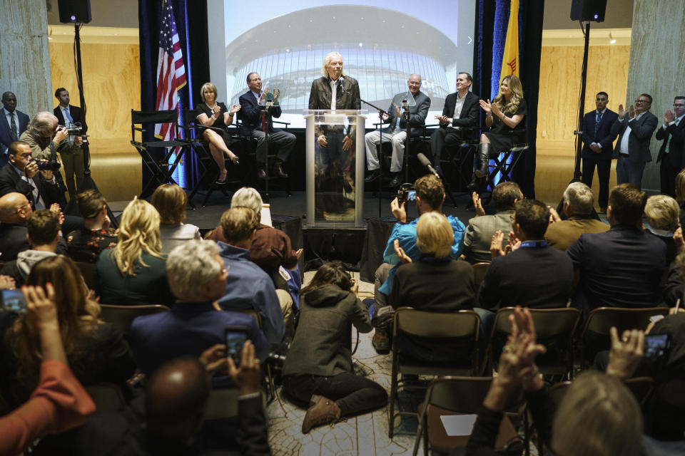 Virgin Galactic founder Sir Richard Branson announces the company's move to New Mexico as they near the first commercial flights from the Spaceport America Friday, May 10, 2019, at the state capital in Santa Fe, N.M. (AP Photo/Craig Fritz)