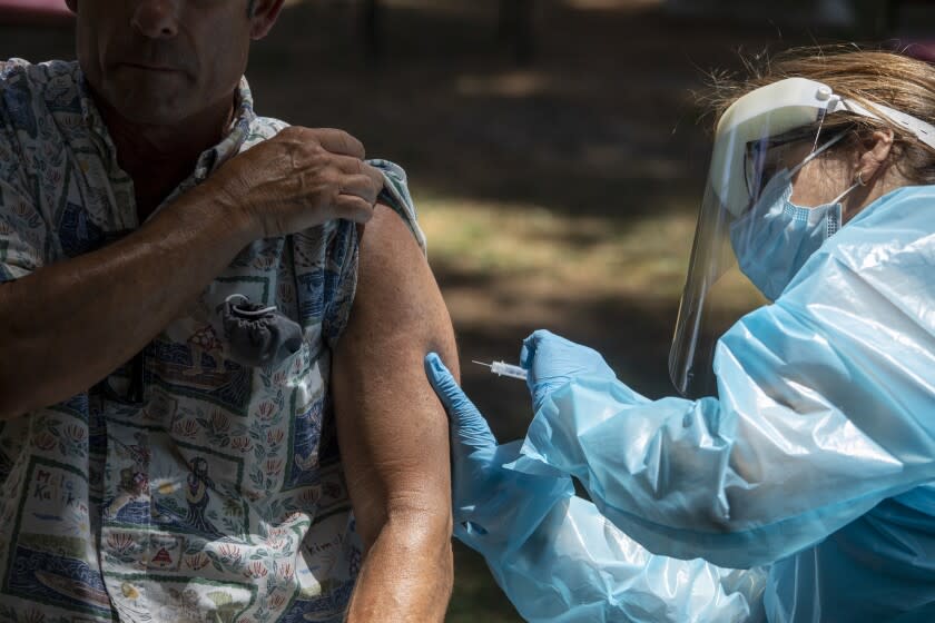 Medical Reserve Corps volunteers administer monkeypox vaccinations at a new walk-up monkeypox vaccination site