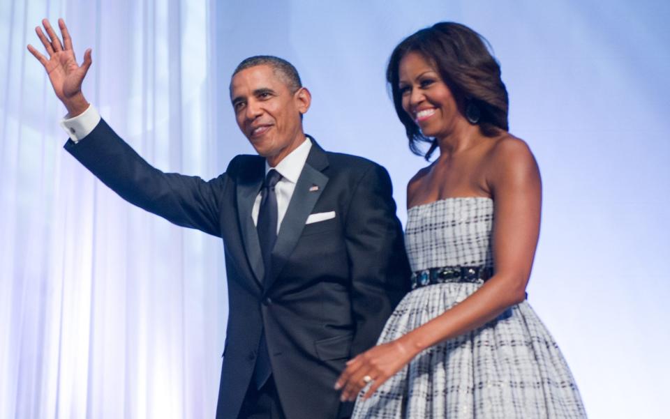 Barack and Michelle Obama - Credit: PAUL J. RICHARDS/AFP/Getty Images