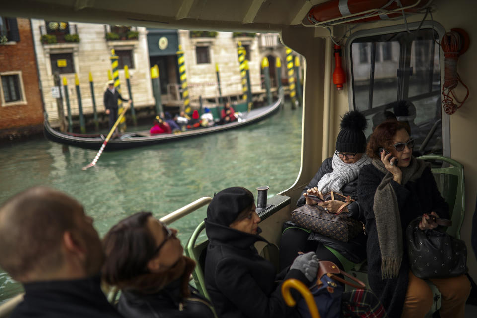 Commuters and tourists take a bus boat in Venice, Italy, Monday, March 2, 2020. (AP Photo/Francisco Seco)