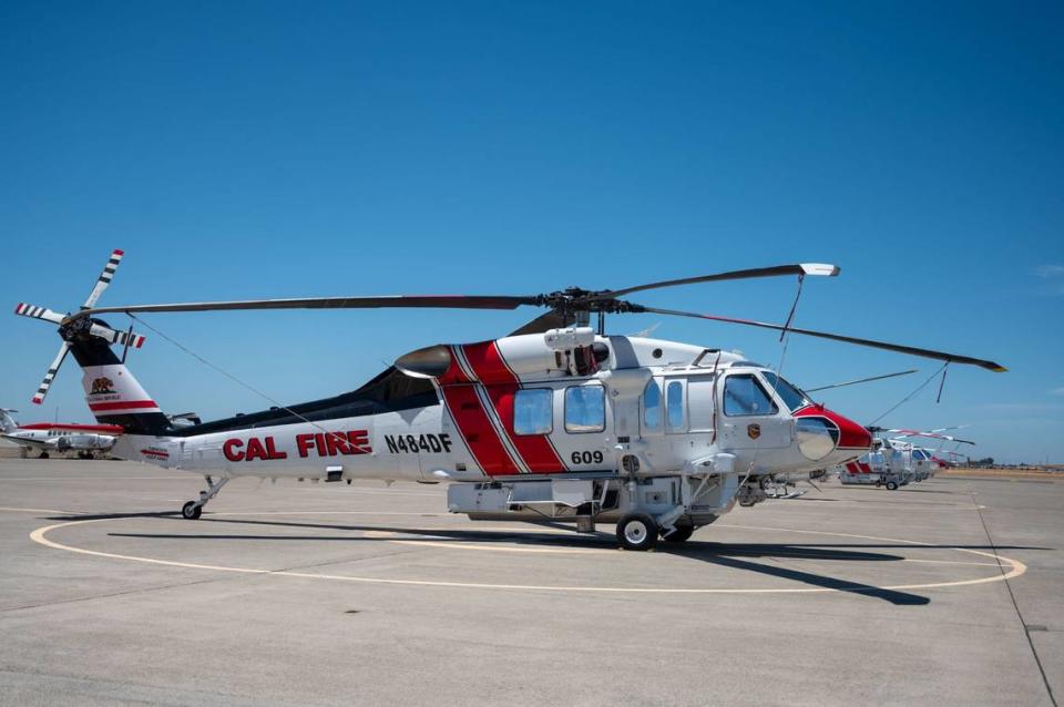 Cal Fire Hawk firefighting helicopters are parked at Cal Fire McClellan Reload Base in McClellan on June 25.