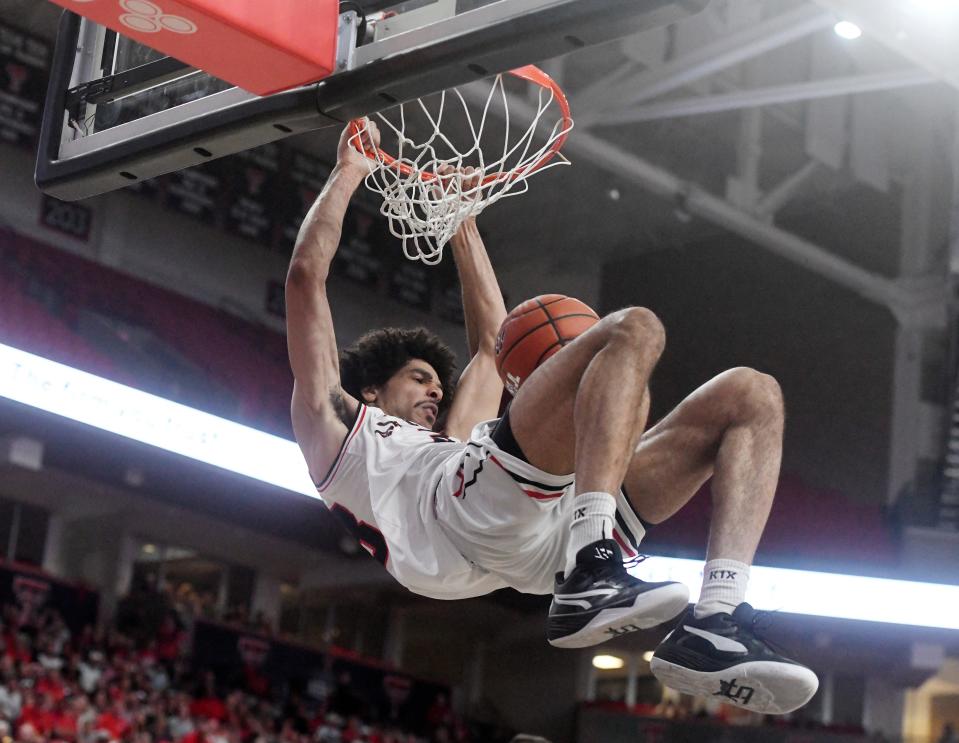 Air Raiders' Zach Smith dunks the ball against the Purple Hearts during the first round of The Basketball Tournament Lubbock Regional, Wednesday, July 19, 2023, at United Supermarkets Arena.