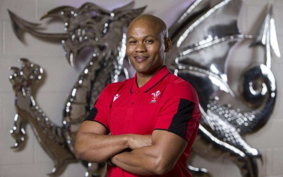 Warren Abrahams poses after being announced as Wales women's head coach - WRU