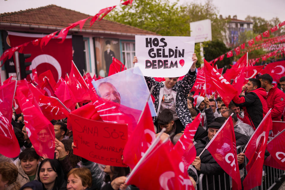 People listen to Kemal Kilicdaroglu, leader of Turkey's main opposition Republican People's Party, CHP, during a campaign rally in Tekirdag, Turkey, on Thursday, April 27, 2023. Boards read in Turkish: "Welcome my grandfather" and "Promise you Spring will come again." Kilicdaroglu, the main challenger to President Recep Tayyip Erdogan in the May 14 election, cuts a starkly different figure than the incumbent who has led the country for two decades. As the polarizing Erdogan has grown increasingly authoritarian, Kilicdaroglu has a reputation as a bridge builder and vows to restore democracy. (AP Photo/Francisco Seco)