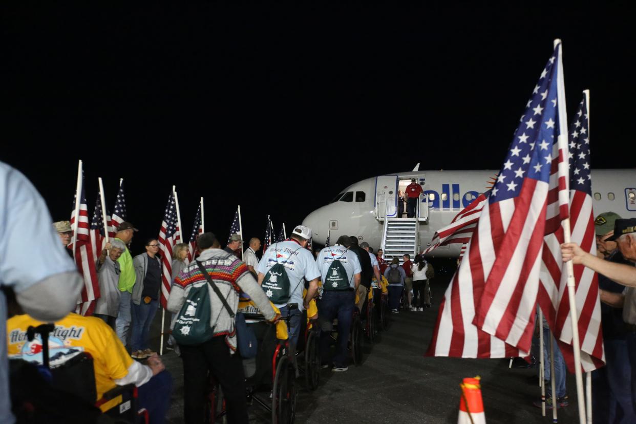 Honor Flight veterans and their guardians load the plane to go to Washington D.C., April 27, 2024.