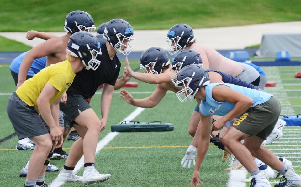 Petoskey linemen go through drills during Monday's practice at Northmen Stadium.