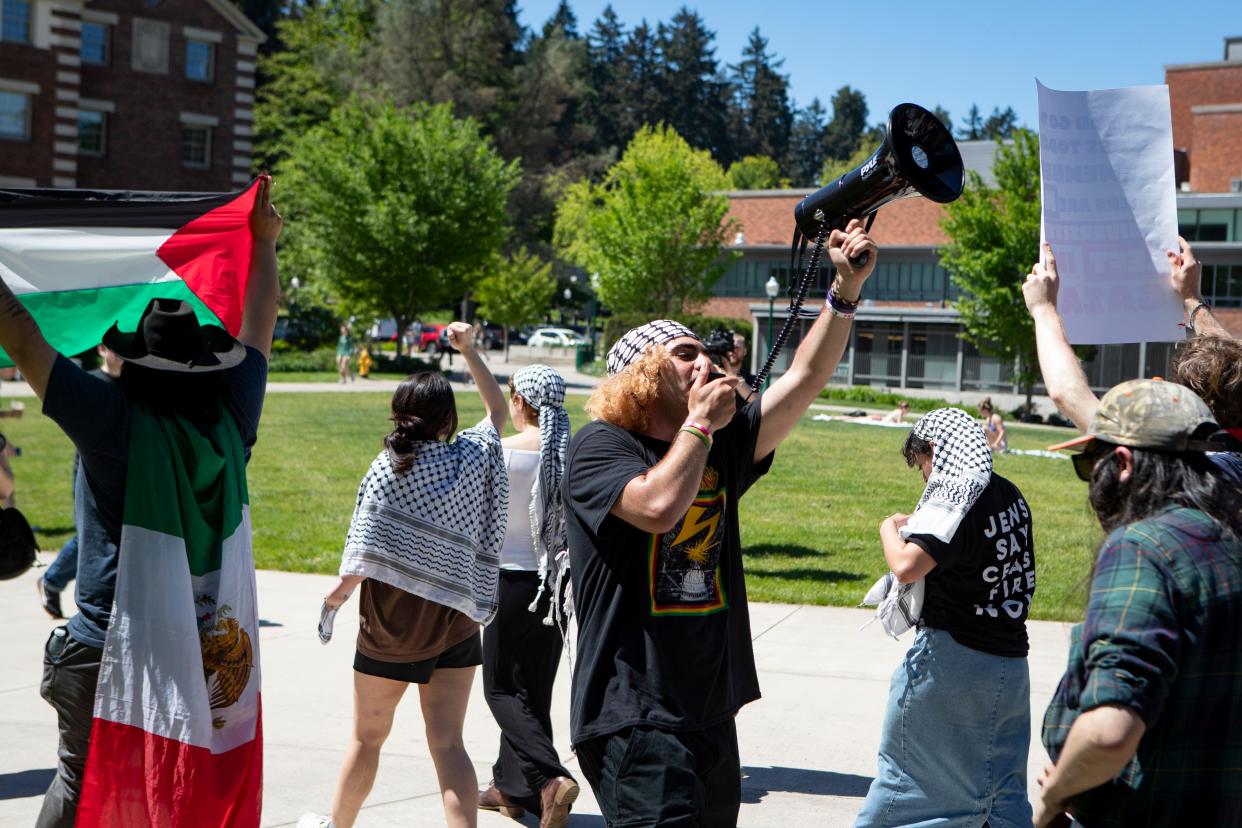 Pro-Palestinian protestors march on the University of Oregon campus Friday, May 10, 2024, in support of a cease-fire in Gaza.