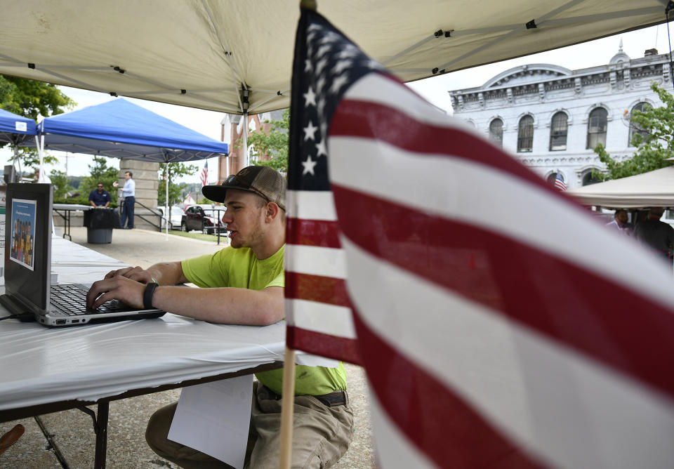 Caleb Antram of Somerset fills out a census form on-line outside of the Somerset Courthouse during the Somerset County commissioners census day party on Tuesday, June 23, 2020. (Todd Berkey/The Tribune-Democrat via AP)