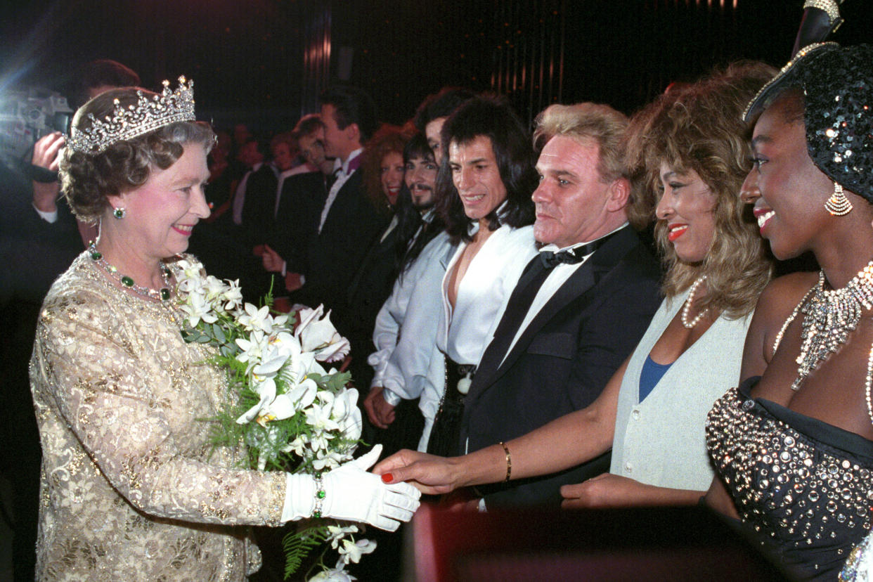 The Queen meets singer Tina Turner, second from the right, watched by comedian Freddie Starr after the Royal Variety Performance at the London Palladium.   (Photo by PA Images via Getty Images)