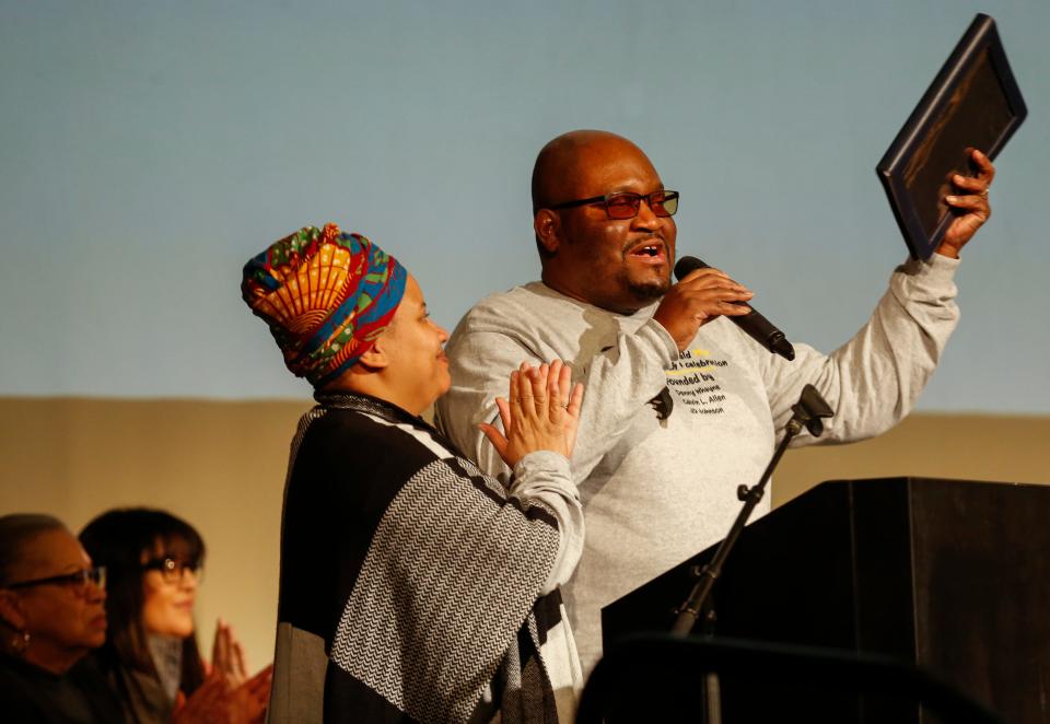 Reverend Adrienne Denson-Ewell and Reverend Russell Ewell deliver the invocation during the program for Martin Luther King Jr. Day at the Gillioz Theatre on Monday, Jan. 20, 2020.