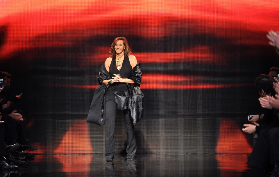 Designer Donna Karan greets the audience after the Donna Karan New York Fall 2014 collection was presented during Fashion Week, Monday, Feb. 10, 2014, at 23 Wall Street in New York. (AP Photo/Diane Bondareff)