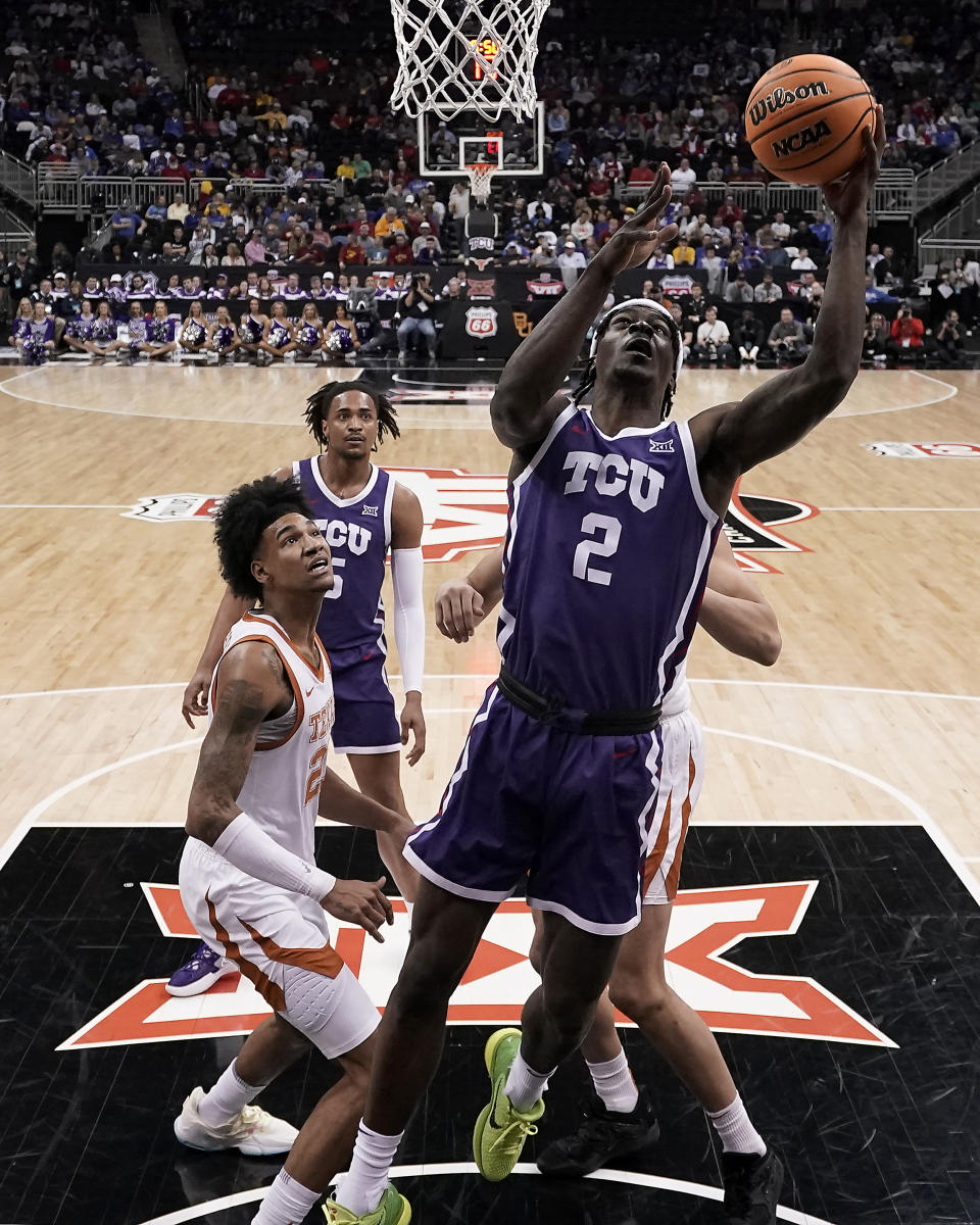 TCU forward Emanuel Miller (2) puts up a shot during the first half of an NCAA college basketball game against Texas in the semifinal round of the Big 12 Conference tournament Friday, March 10, 2023, in Kansas City, Mo. (AP Photo/Charlie Riedel)