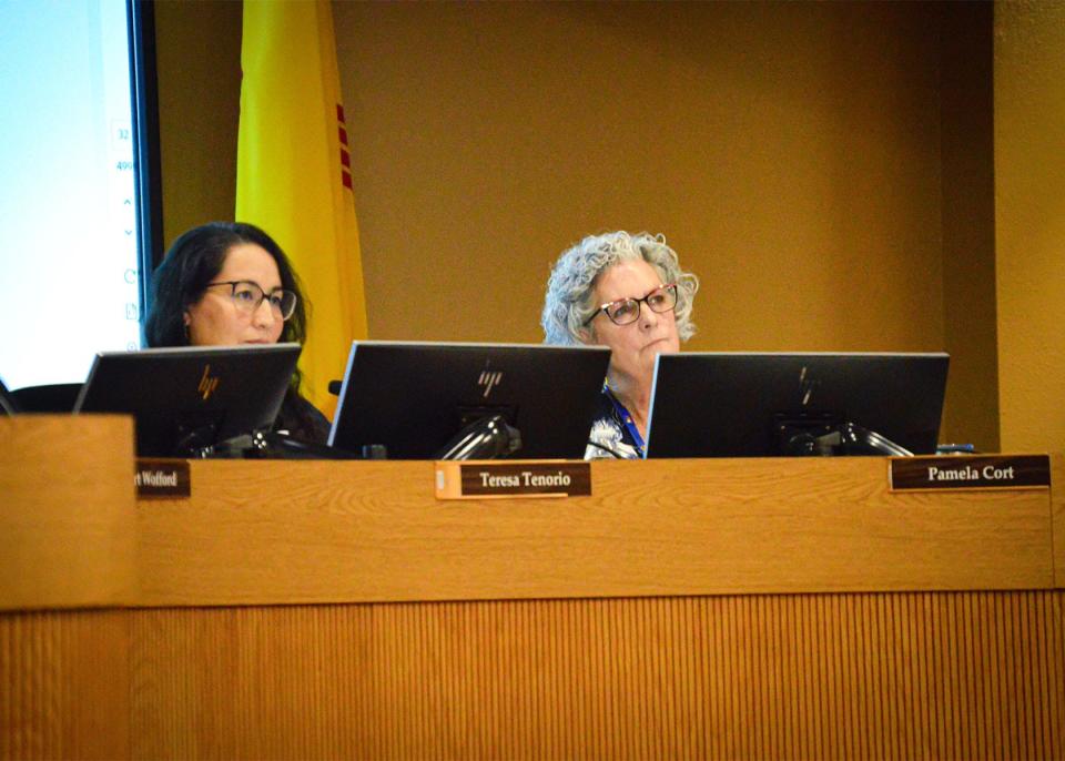Board members Teresa Tenorio, left, and Pamela Cort, right, listen to presenters during an Aug. 15, 2023, school board meeting.