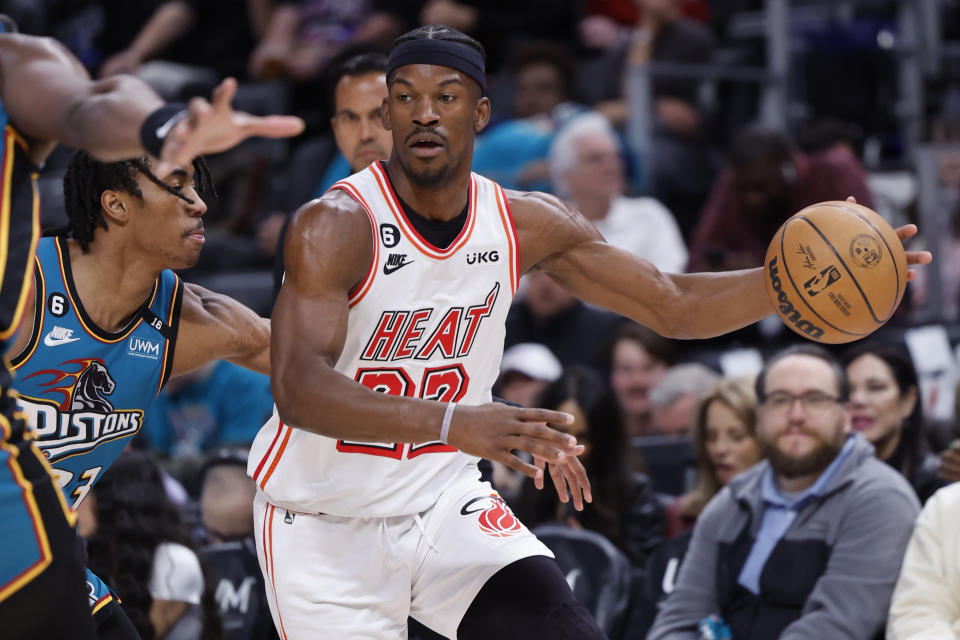 Miami Heat forward Jimmy Butler dribbles while being defended by Detroit Pistons guard Jaden Ivey in the first half of their game at Little Caesars Arena in Detroit on April 4, 2023. (Rick Osentoski/USA TODAY Sports)