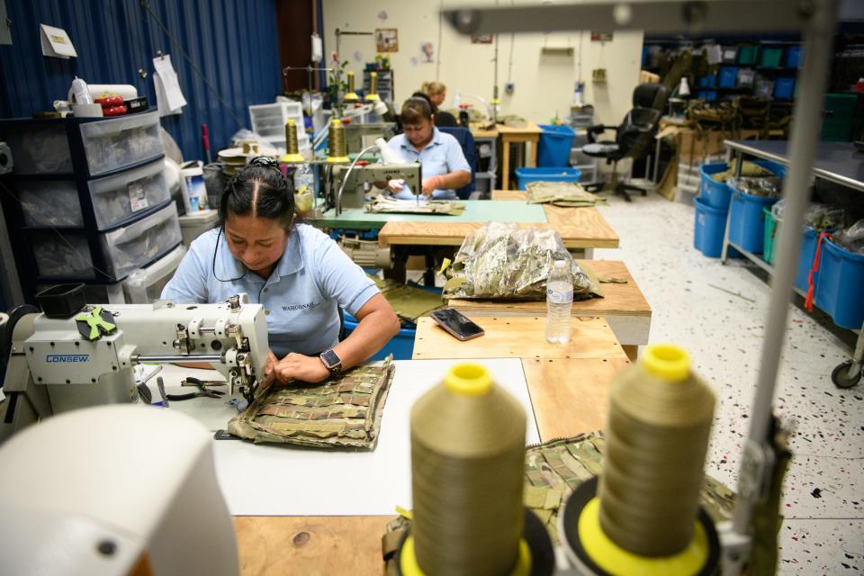 A seamstress works on repairing an U.S. Army plate carrier at the Wahconah Tactical Services Division on McMillan Street in Fayetteville on Thursday, July 20, 2023. Wahconah is partnering with Hagor Industries Ltd. of Israel to open a manufacturing operation to make plate carriers and other equipment for the American military.