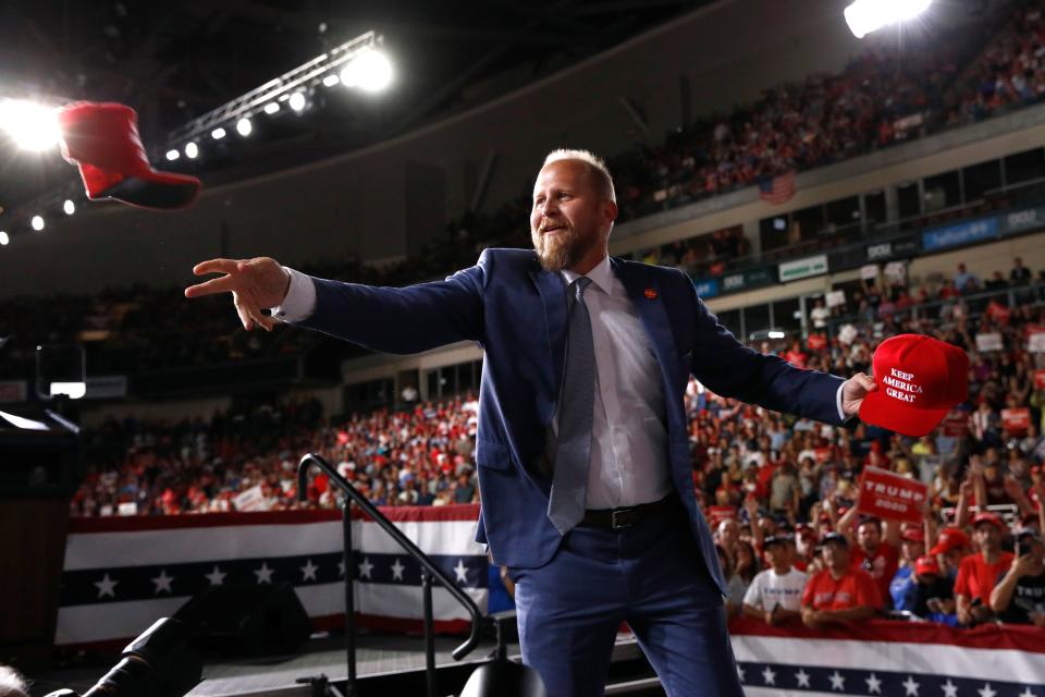 Brad Parscale, campaign manager for President Donald Trump, tosses a hat to supporters before Trump speaks at a campaign rally, Thursday, Aug. 15, 2019, in Manchester, N.H. 
