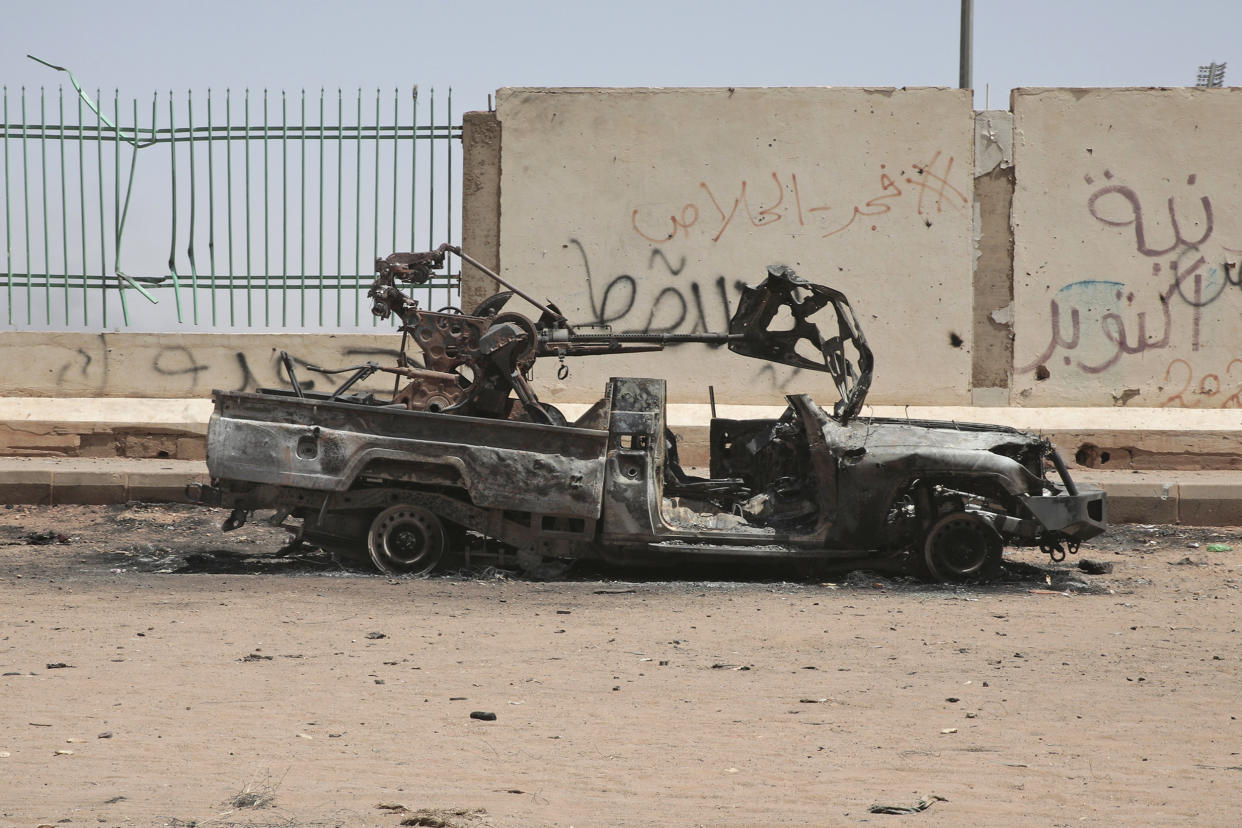A destroyed military vehicle in Khartoum, Sudan, on April 20, 2023. (Marwan Ali / AP)