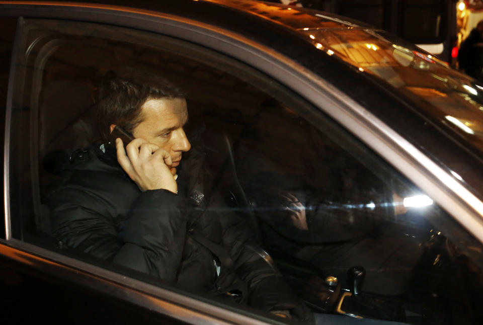 Democratic Party secretary Matteo Renzi leaves after speaking at a party leadership meeting to decide whether to yank support from Letta's fragile coalition government, accusing the premier of failing to make progress on key financial reforms, in Rome Thursday, Feb. 13, 2014. Italian Premier Enrico Letta announced that he is resigning after his party rival Renzi withdrew essential support for his tattered, 10-month-old coalition government. Letta said he will hand in his resignation to Italy's president on Friday, Feb. 14. (AP Photo/Riccardo De Luca)