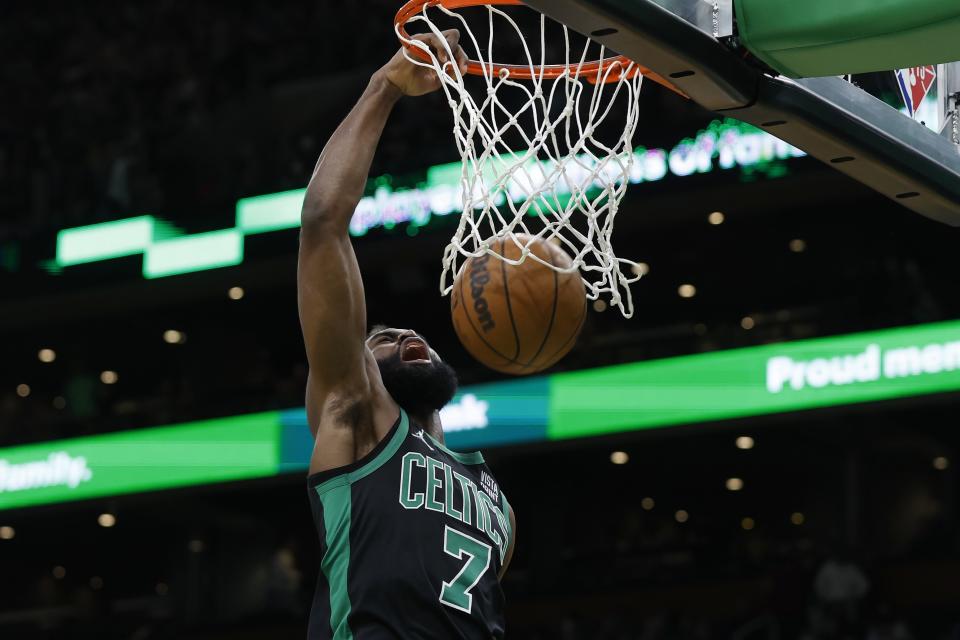 Boston Celtics' Jaylen Brown dunks during the second half of an NBA basketball game against the Chicago Bulls, Saturday, Jan. 15, 2022, in Boston. (AP Photo/Michael Dwyer)