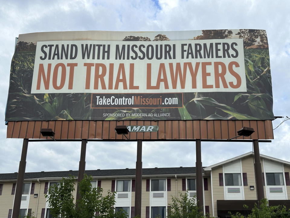 A billboard supporting legislation that would provide legal protection to manufacturers of pesticides such as Bayer's popular weedkiller Roundup, is shown in Jefferson City, Mo., on May 13, 2024. (AP Photo/David A. Lieb)