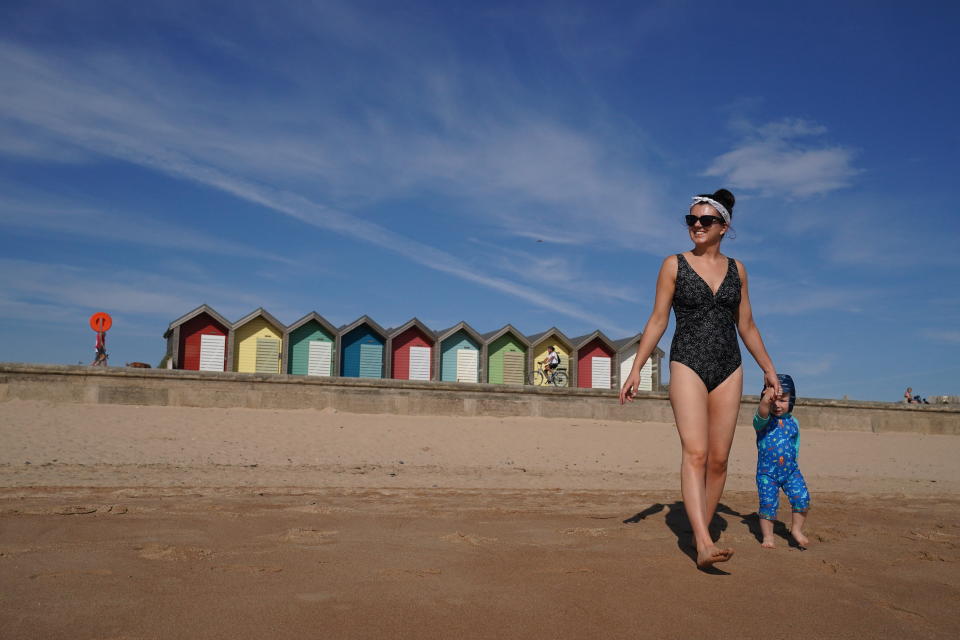 Mother and child on beach