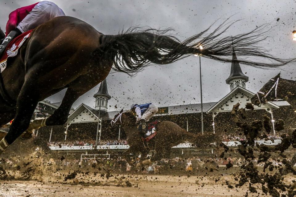 The tail of War of Will frames the twin spires of Churchill Downs in the final stretch of Kentucky Derby 145 with jockey Tyler Gaffallione aboard.  The horse tangled with Maximum Security in the far turn of the race and eventually finished 6th.  Maximum Security was disqualified and Country House became the race winner.