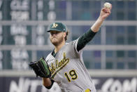 Oakland Athletics starting pitcher Cole Irvin (19) throws against the Houston Astros during the first inning of a baseball game Sunday, Aug. 14, 2022, in Houston. (AP Photo/Michael Wyke)