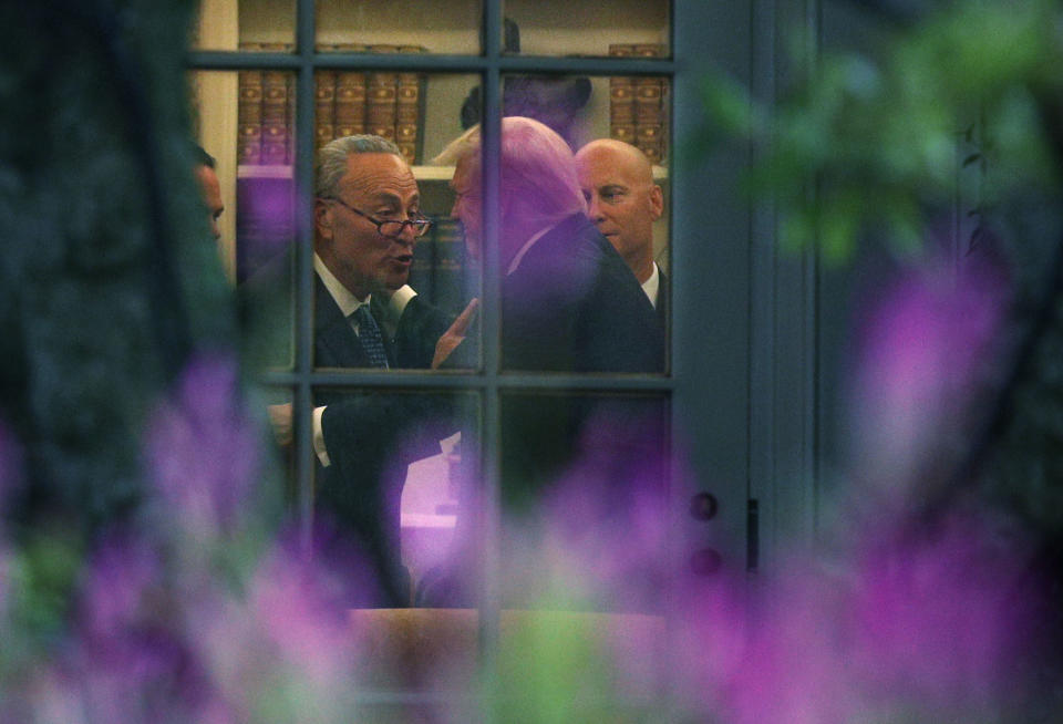 Senate Minority Leader Chuck Schumer, left, makes a point to President Trump in the Oval Office Sept. 6. (Photo: Alex Wong/Getty Images)