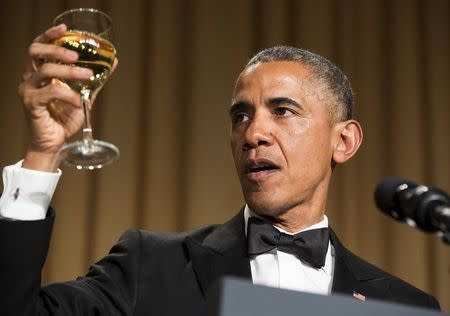 U.S. President Barack Obama makes a toast at the 2015 White House Correspondents Association Dinner in Washington April 25, 2015. REUTERS/Joshua Roberts