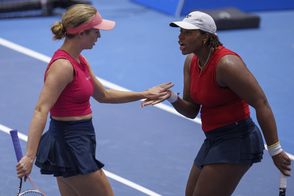 US Sloane Stephens, right, and Taylor Townsend celebrate a point against Czech Republic's Barbora Krejcikova and Katerina Siniakova during their group stage tennis doubles match at the Billie Jean King Cup finals at La Cartuja stadium in Seville, southern Spain, Spain, Friday, Nov. 10, 2023. (AP Photo/Manu Fernandez)