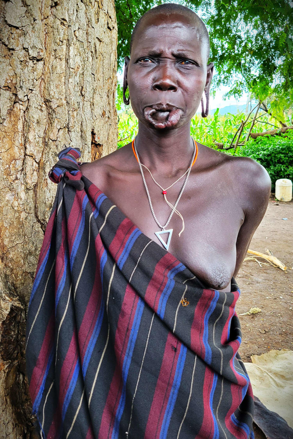 <div class="inline-image__caption"><p>A Mursi woman poses for a portrait without her lip plate.</p></div> <div class="inline-image__credit">Jody Ray</div>