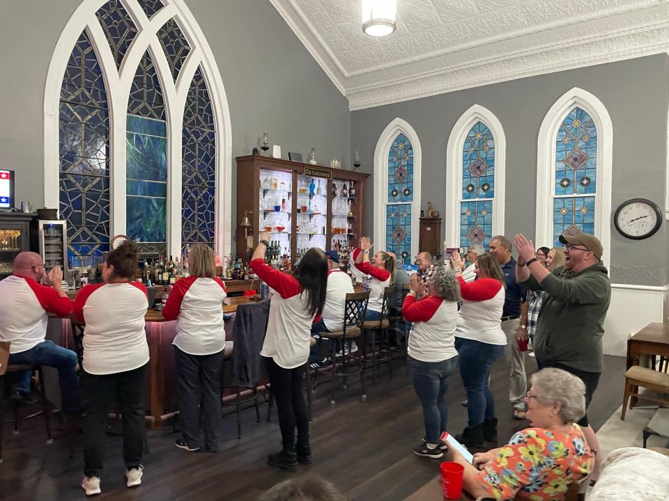 Friends and campaign volunteers cheer for Valerie Mockus as she announced on Nov. 7 that she had been elected mayor of Hebron.