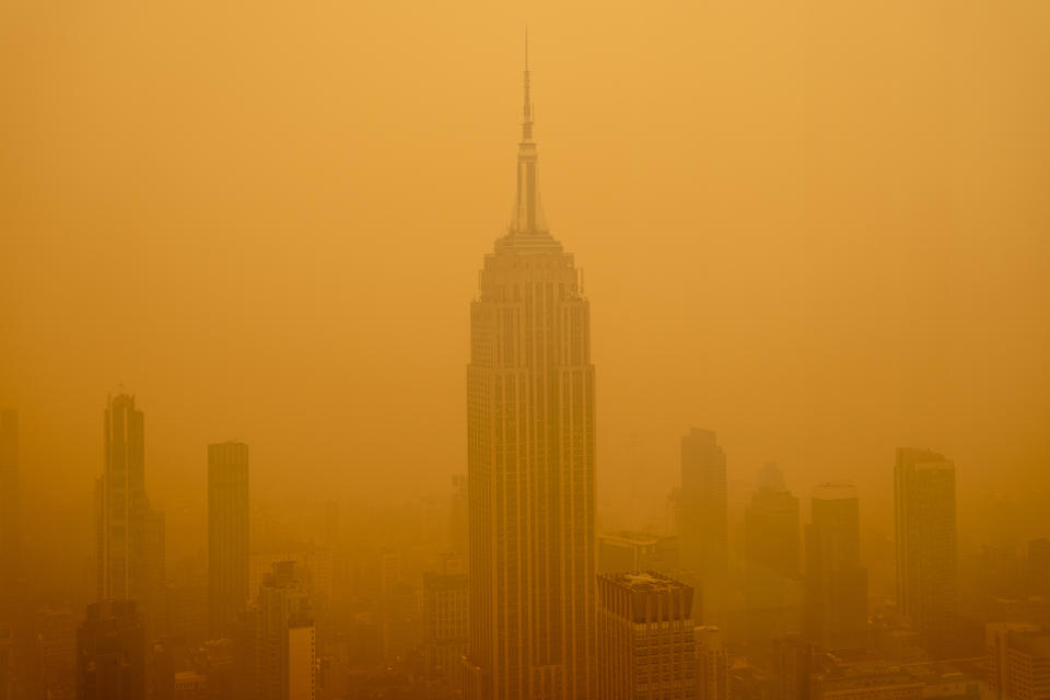 Smoky haze from wildfires in Canada diminishes the visibility of the Empire State Building 