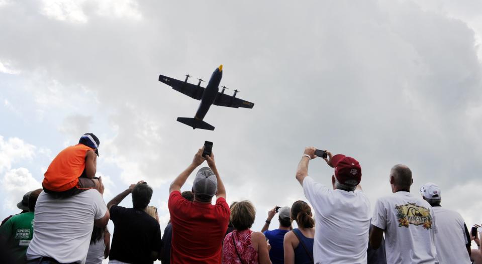 To the delight of the crowd, the Blue Angels C-130 support plane "Fat Albert" makes a low pass over aviation fans at Sunday afternoon's ShrinersFest Air Show, June 28, 2015.