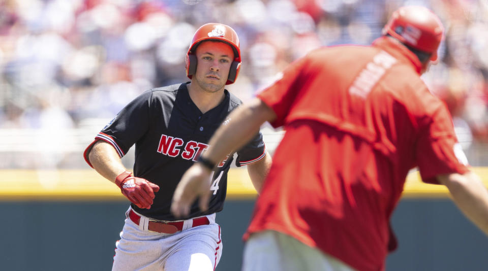 North Carolina State's Jonny Butler (14) rounds the bases after hitting a two-run home run against Stanford in the first inning in the opening baseball game of the College World Series, Saturday, June 19, 2021, at TD Ameritrade Park in Omaha, Neb. (AP Photo/Rebecca S. Gratz)