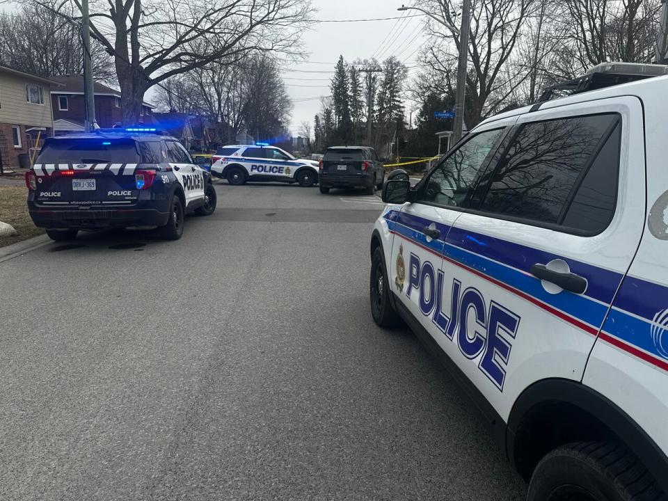 Ottawa police vehicles at the scene of a shooting at Avondale and Tweedsmuir avenues Friday afternoon.