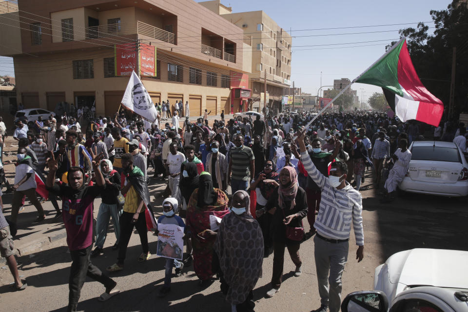 People march during a protest to denounce the October military coup, in Khartoum, Sudan, Thursday, Dec. 30, 2021. The October military takeover upended a fragile planned transition to democratic rule and led to relentless street demonstrations across Sudan. (AP Photo/Marwan Ali)