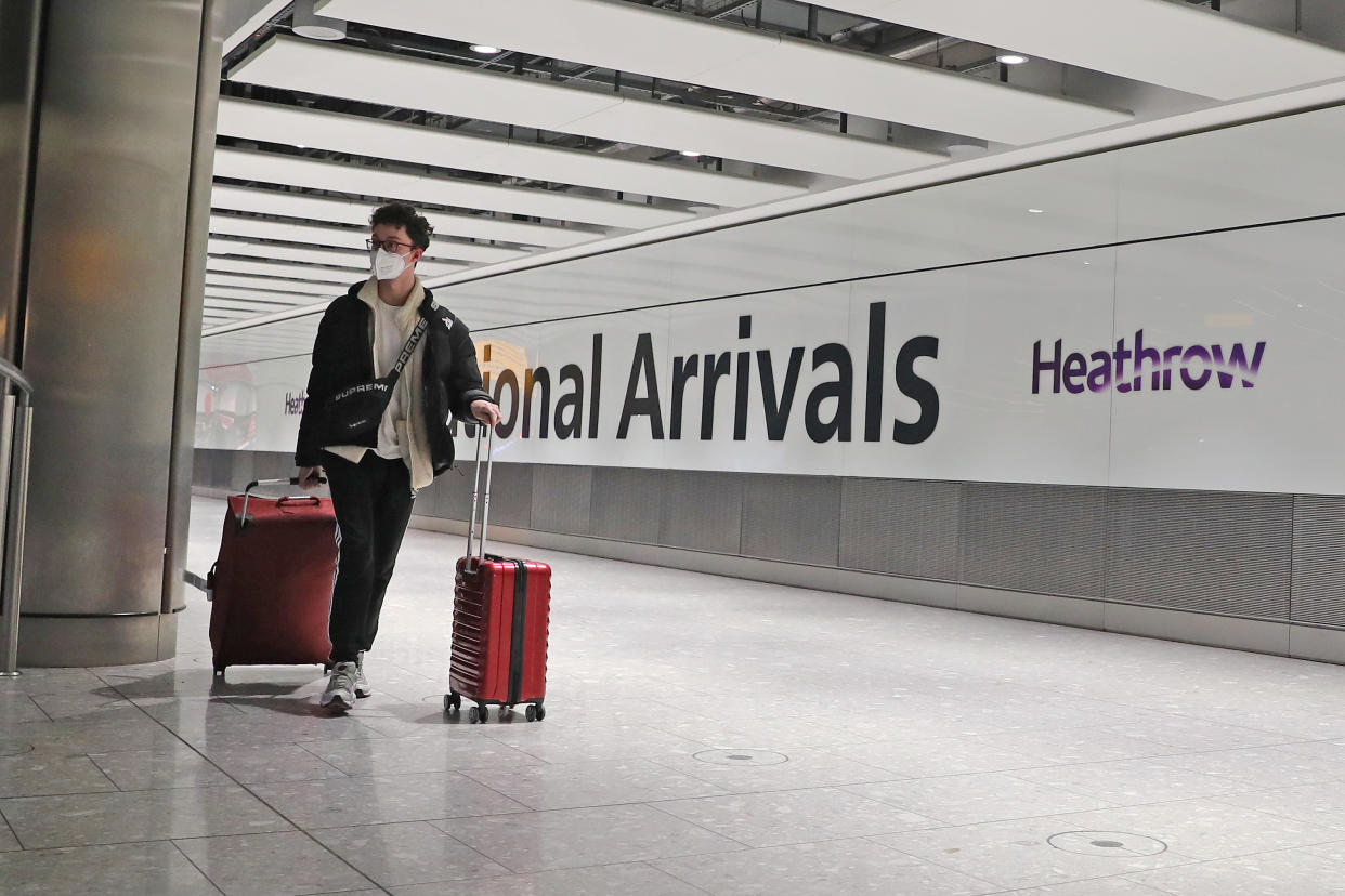 Passengers arrive at Heathrow Airport in London after the last British Airways flight from China touched down in the UK following an announcement that the airline was suspending all flights to and from mainland China with immediate effect amid the escalating coronavirus crisis.